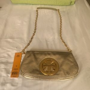 Tory Burch clutch purse gold , excellent condition,only worn twice